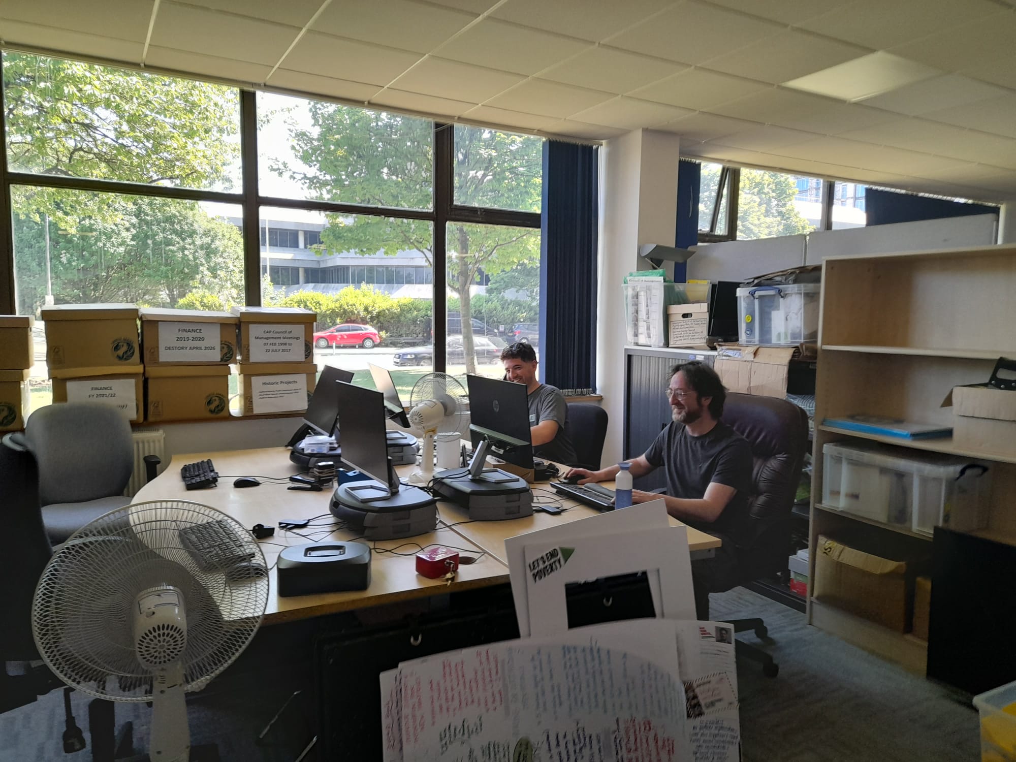 Liam and Dan at their desks in our new office