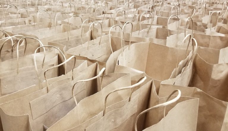 rows of brown paper lunch bags