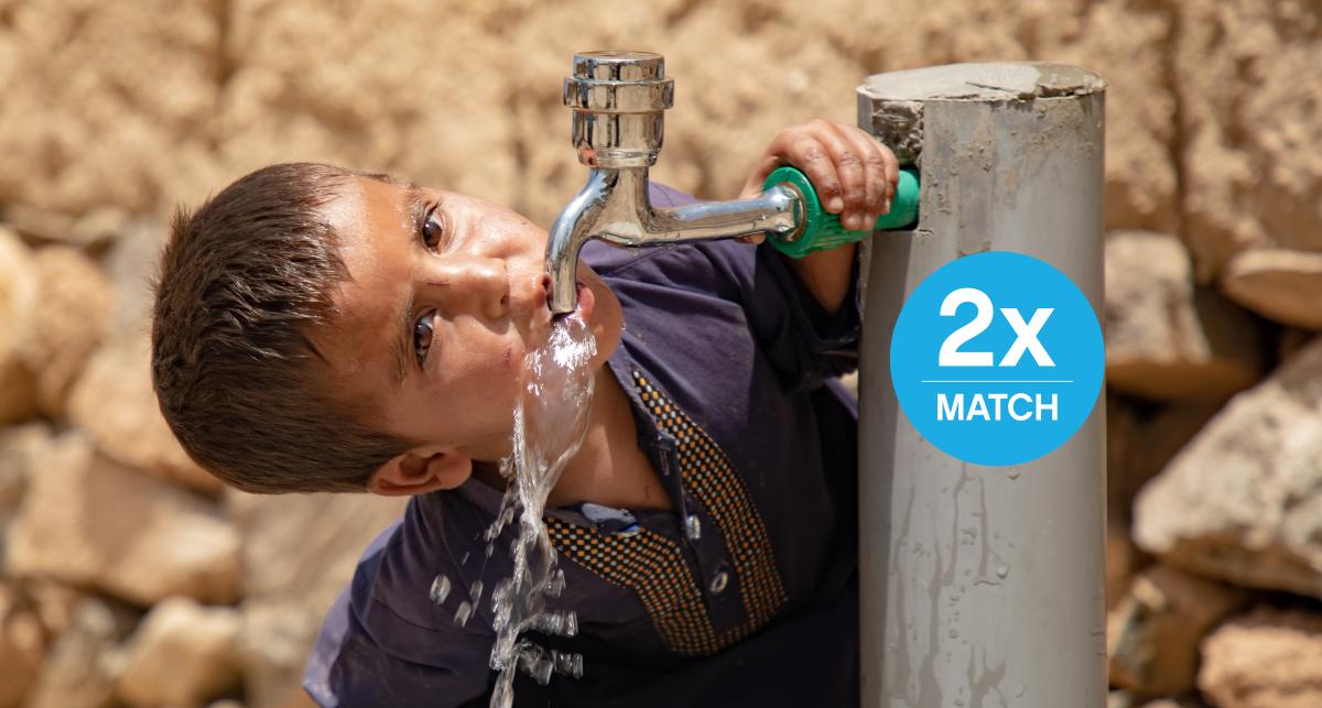 Three-year-old child [boy] drinks from the new water tap at his home in eastern Afghanistan.