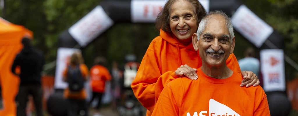 An image of a man and woman looking into camera