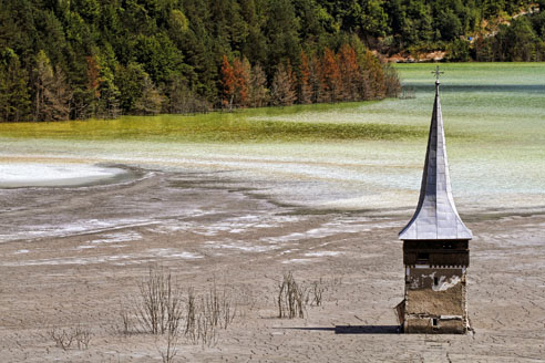 Geamana in the Carpathian Mountains in Romania - an abandoned village in what is now a toxic tailings pond from a nearby copper mine. Photo: Glyn Thomas Photography