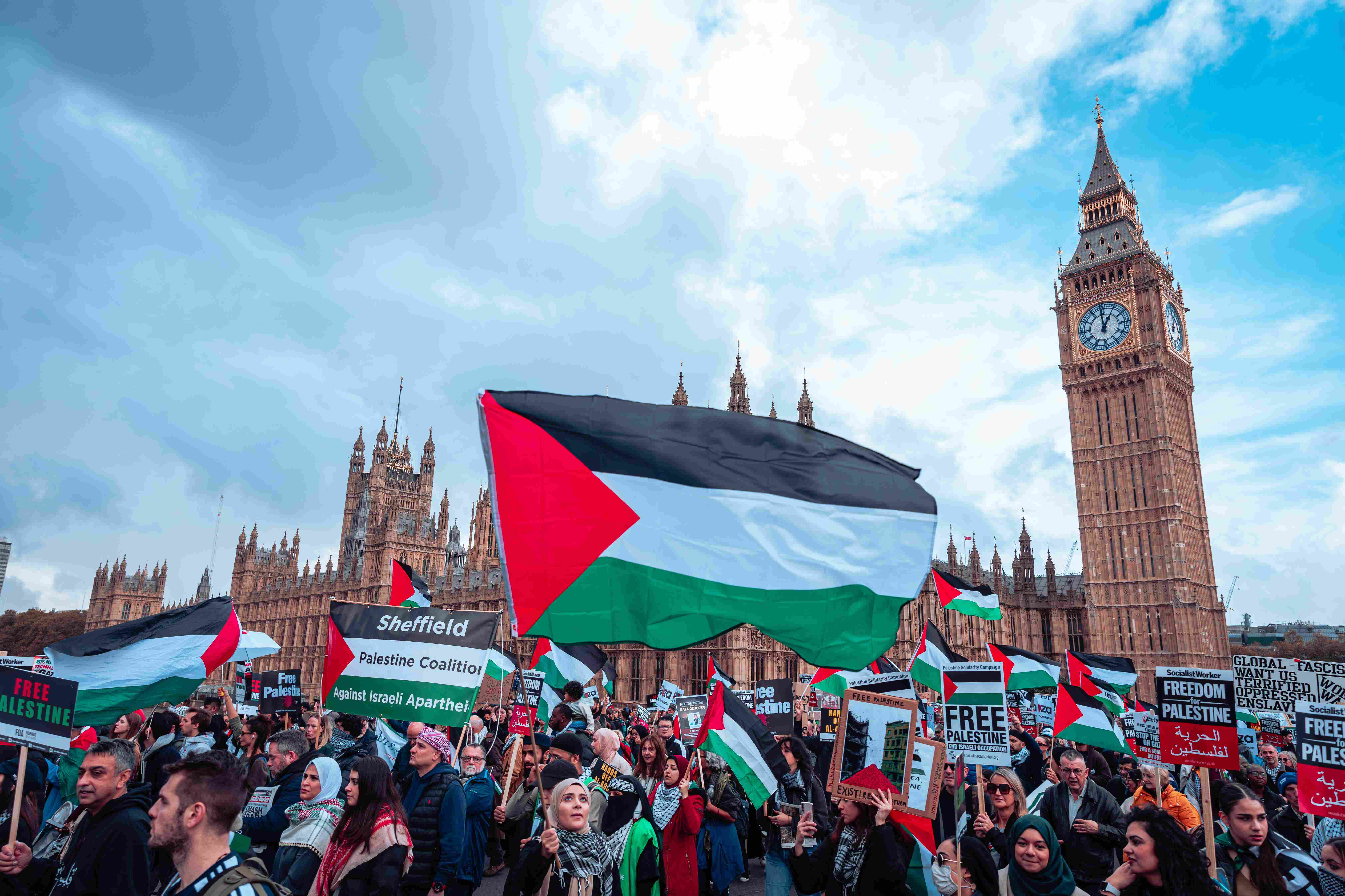 Palestine flag being waved in front of Westminster Abbey, London