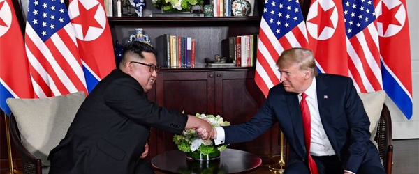 Trump and Kim shake hands