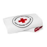 A folded Canadian Red Cross blanket.