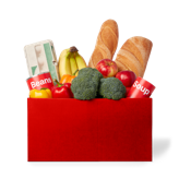 A box filled with nutritious food such as broccoli, a baguette, bananas, and non-perishable foods.