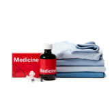 Folded clothing, a box and bottle of medicine and syringes.