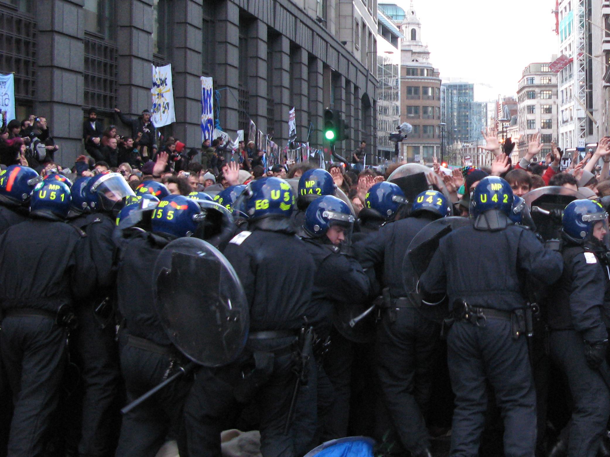 photo of riot police officers "kettle" protesters at the Bishopsgate Climate Camp, London, 1 April 2009