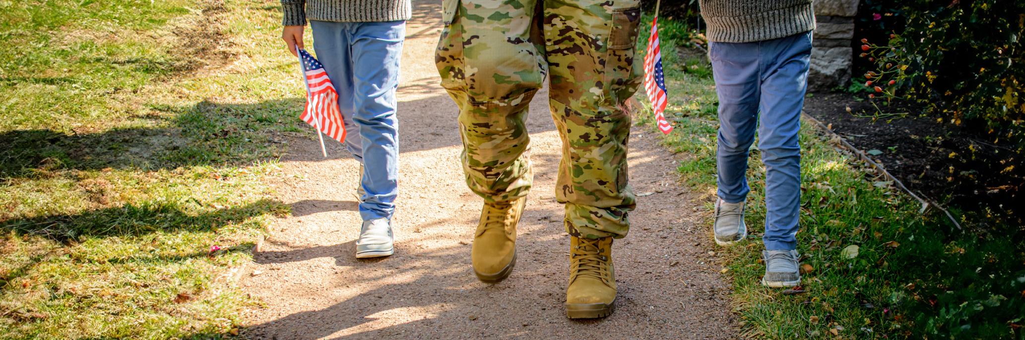 Children walking with veteran