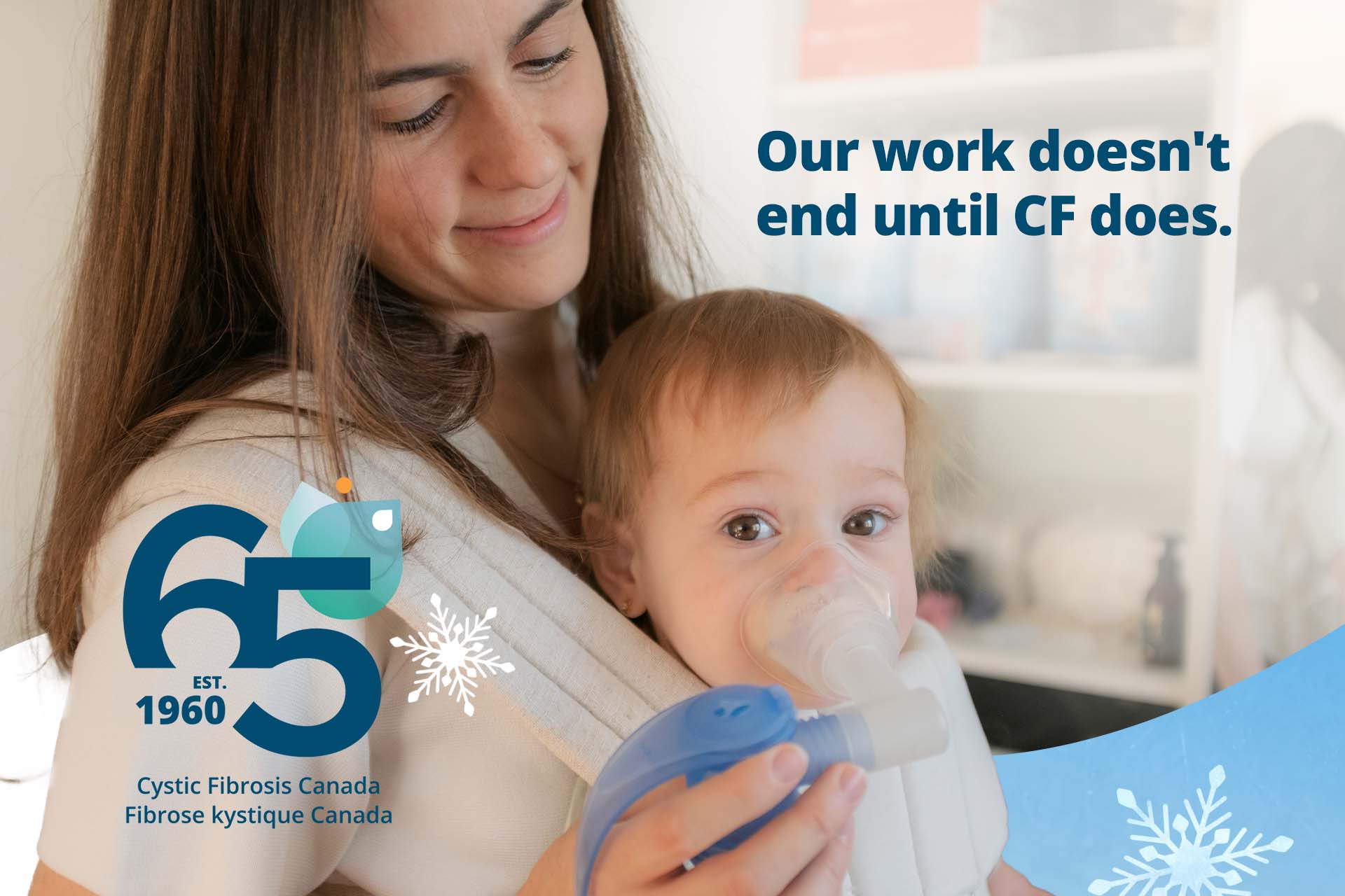 A young mother holds her toddler in a baby carrier who is using a nebulizer fir CF treatment. 