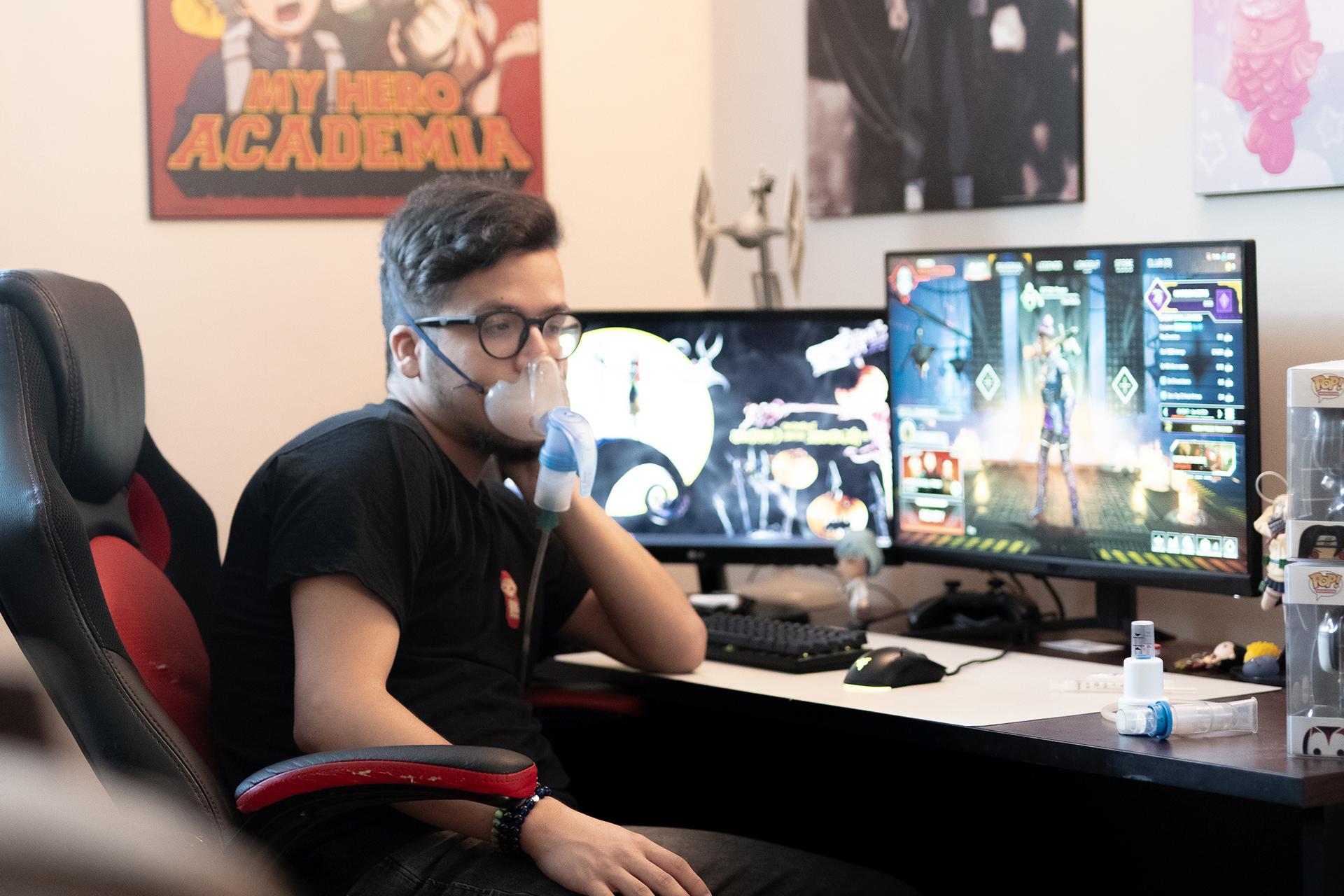 Matthew Tirabassi sitting at his gaming desk.
