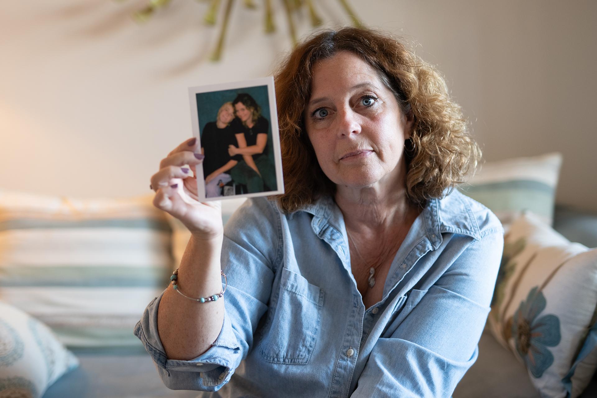 Patricia Vollick holding a photo of her son, Mac