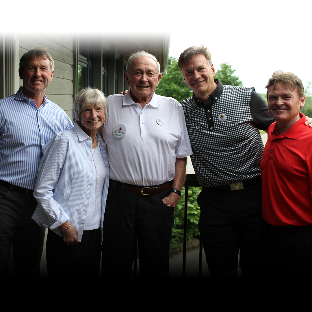 group of people standing together for a picture outside