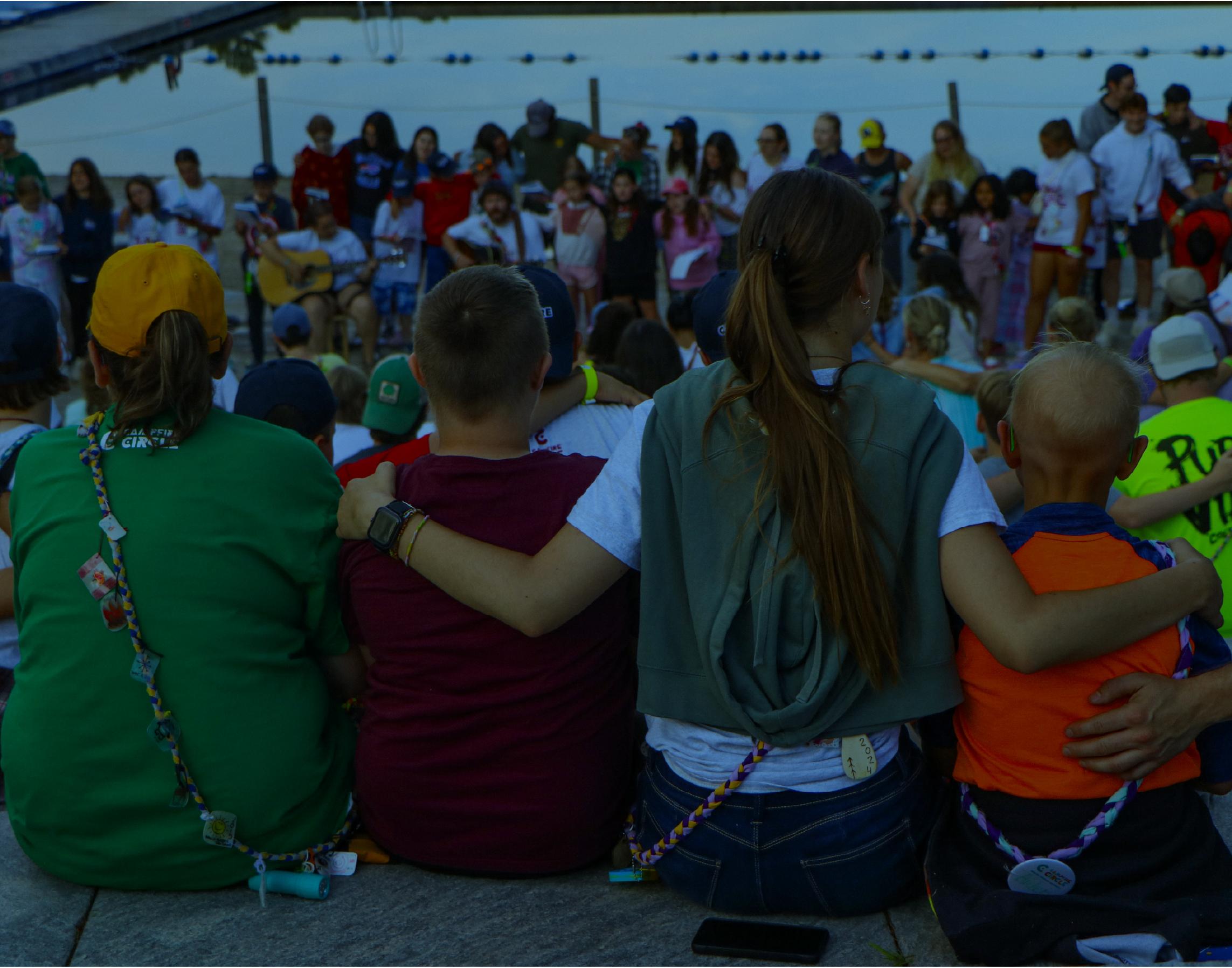 campers in a canoe on the lake at camp