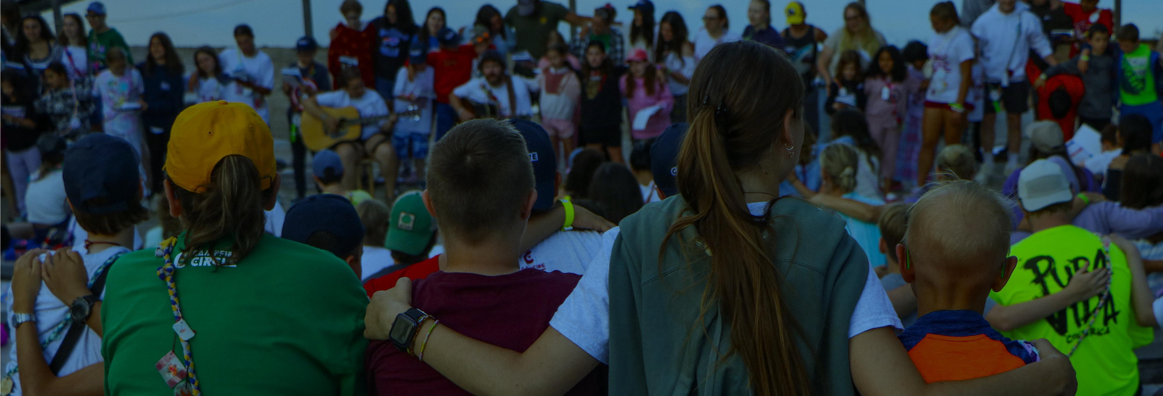 campers in a canoe on the lake at camp