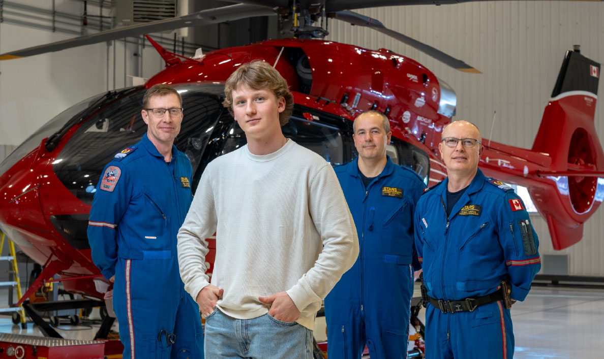 Portrait of STARS Very Important Patient Thomas and her Crew in the STARS Hangar