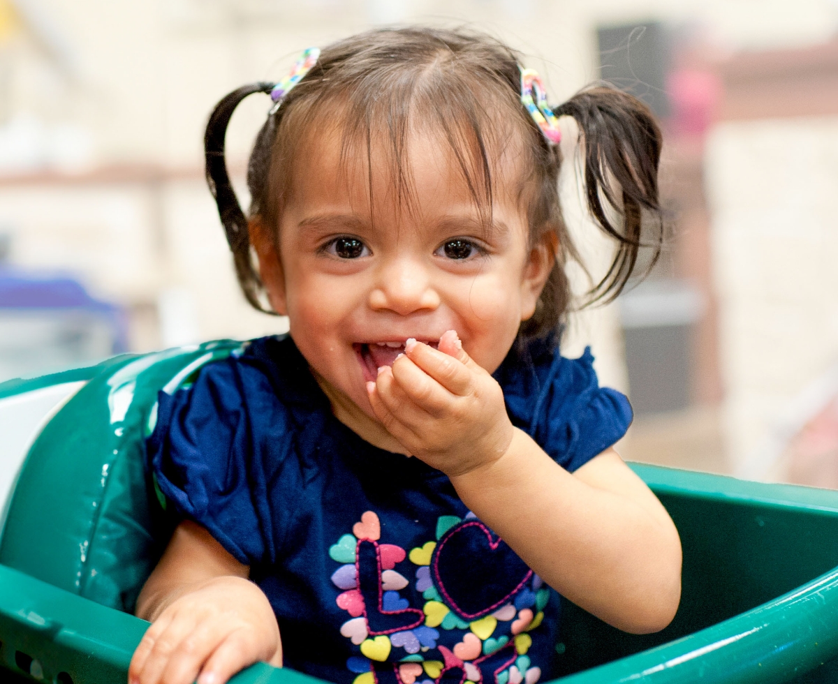 A child wearing a pink shirt