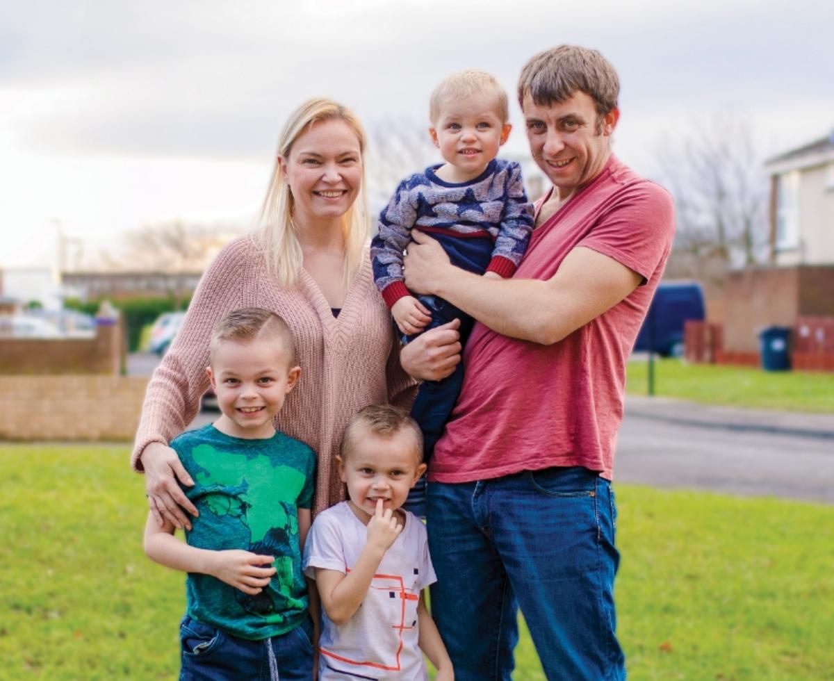 A smiling family of 5, who would benefit from the assistance of The Salvation Army.