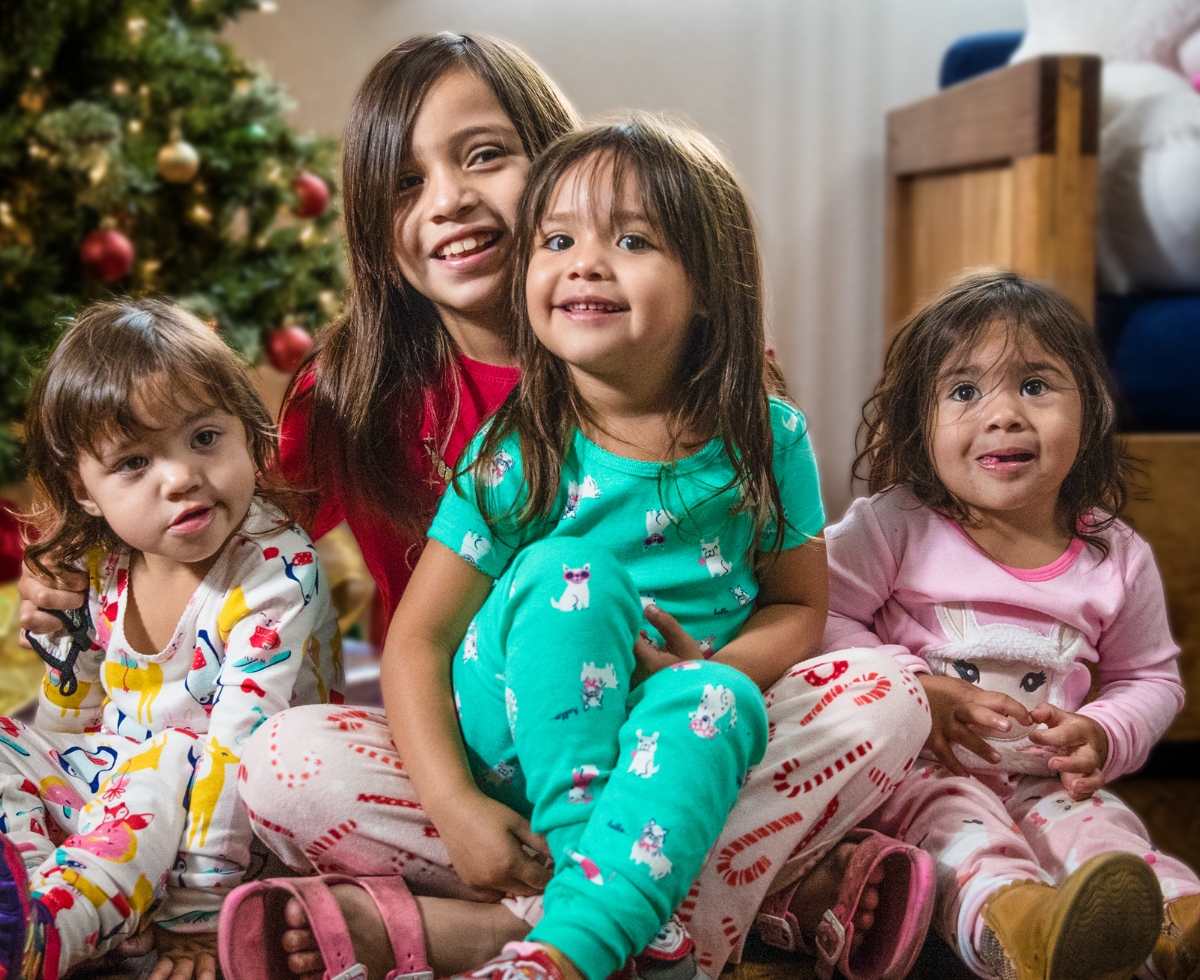 Children infrot of Christmas Tree