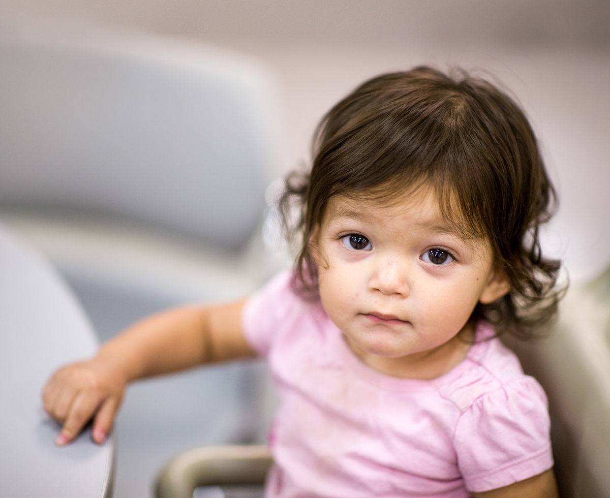 A child wearing a pink shirt