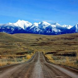 Photo of a long road in Montana countryside