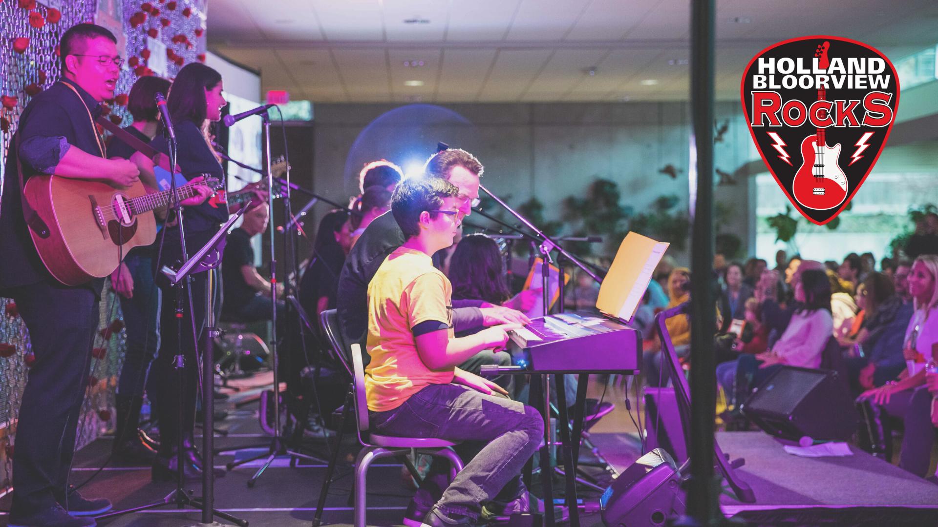 Image contains a band playing with Holland Bloorview Rocks logo on the right side