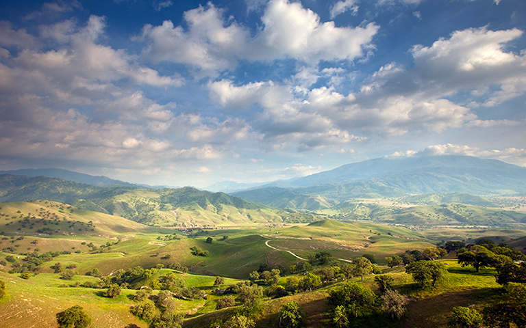 Scenic views of the rolling green hills and oak trees of the Tollhouse Ranch in California. &copy; Ian Shive