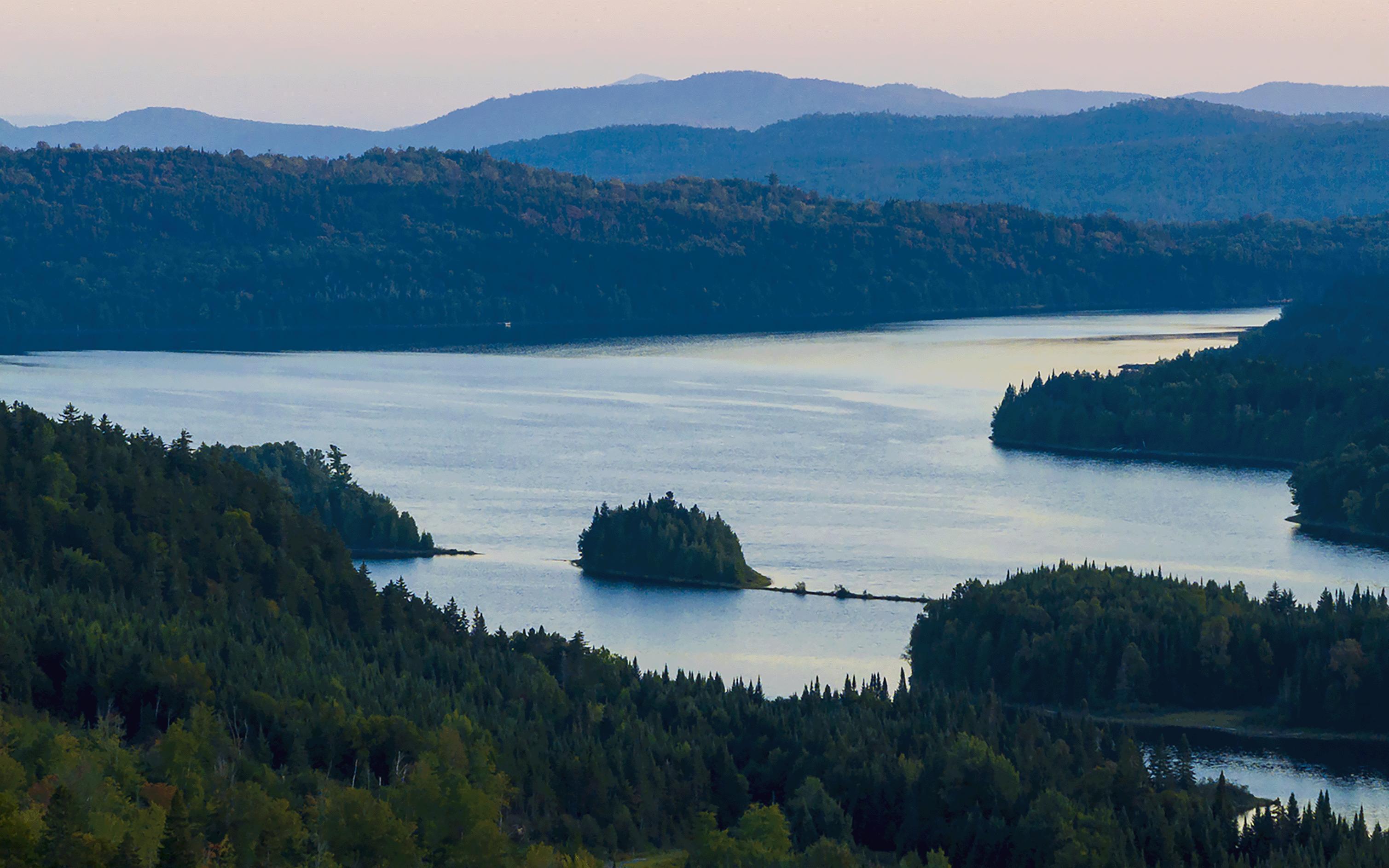 Scenic sunrise view of mountains in the distance and the Magalloway River in the foreground. © Jerry Monkman/EcoPhotography