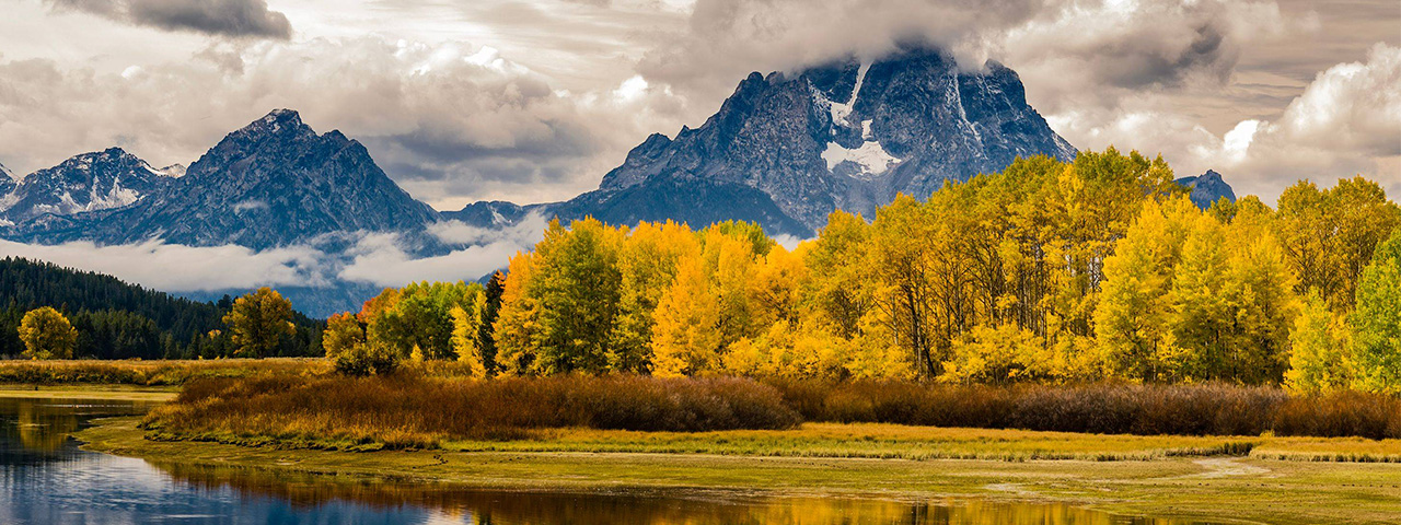 Oxbow Bend refection // Oxbow Bend reflection displaying its fall colors in Grand Teton National Park, Wyoming © Tom Ingram/TNC Photo Contest 2023