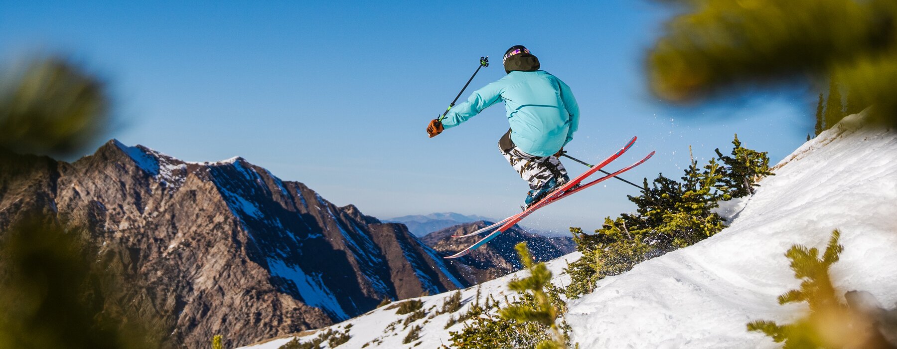 A skier mid-air at Snowbird, UT. Photo Credit: Snowbird