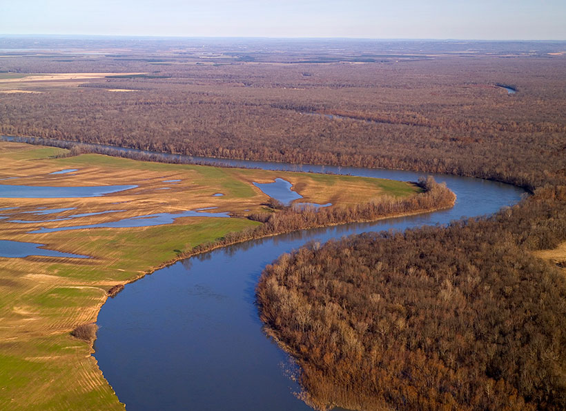 An aerial view of the White River bending through forest and farm fields north of the Wattensaw Wildlife Management Area in Arkansas. &copy; Mark Godfrey/TNC