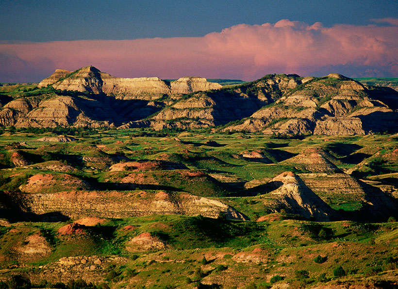 Late afternoon light and distant storm clouds over the south unit of Theodore Roosevelt National Park in North Dakota. &copy; Mark Godfrey/TNC