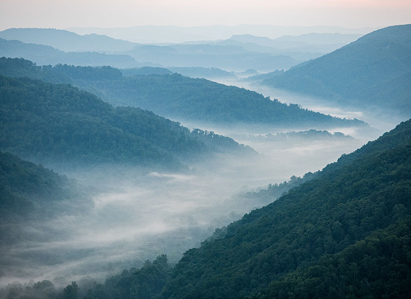 Aerial photograph of fog and mountains taken in the early morning near LaFollette, Tennessee. &copy; Cameron Davidson