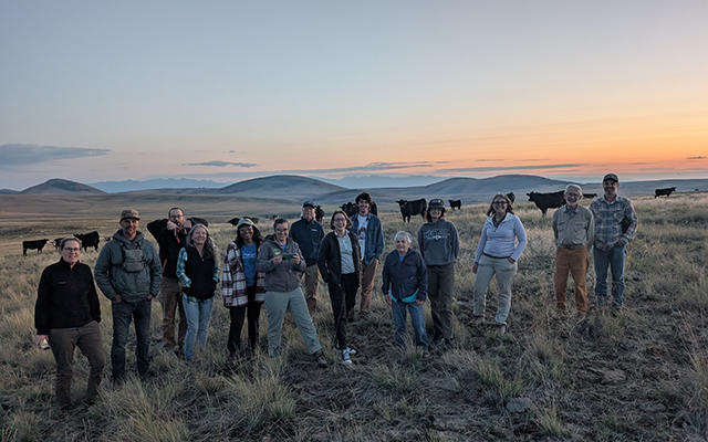 A group of volunteers pose for a photo in the landscape at Zumwalt Prairie Preserve. © Sandra Farrell/TNC