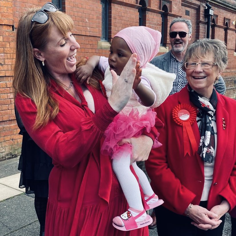 Angela Rayner high fiving a child