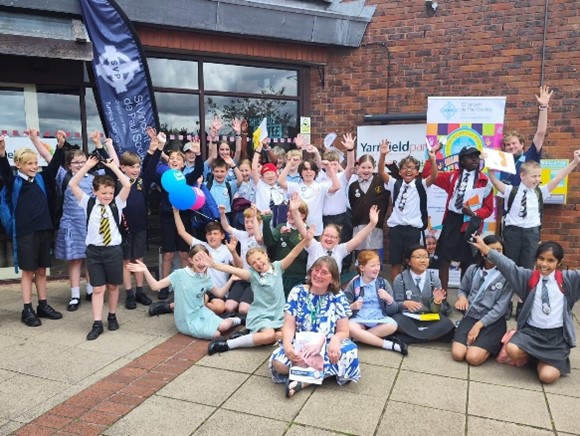 This is an image of the Mini Vinnies outside of the conference centre with the SVP CEO, Elizabeth Palmer