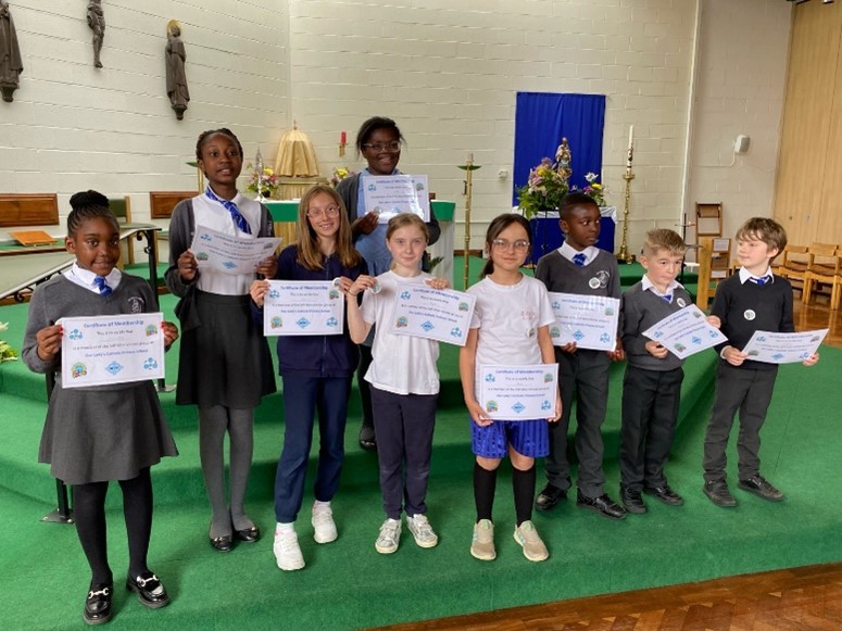 This is a photo of the Mini Vinnies holding up their certificates.