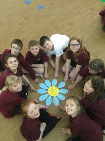This is a picture of more Mini Vinnies around their forget-me-not flower