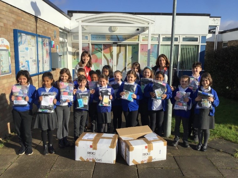 This is a photo of the children with Vinnie Pack donations