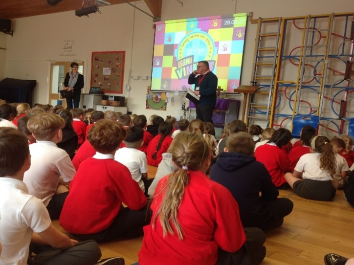 This is a photo of the adult SVP Conference presenting to the children in assembly