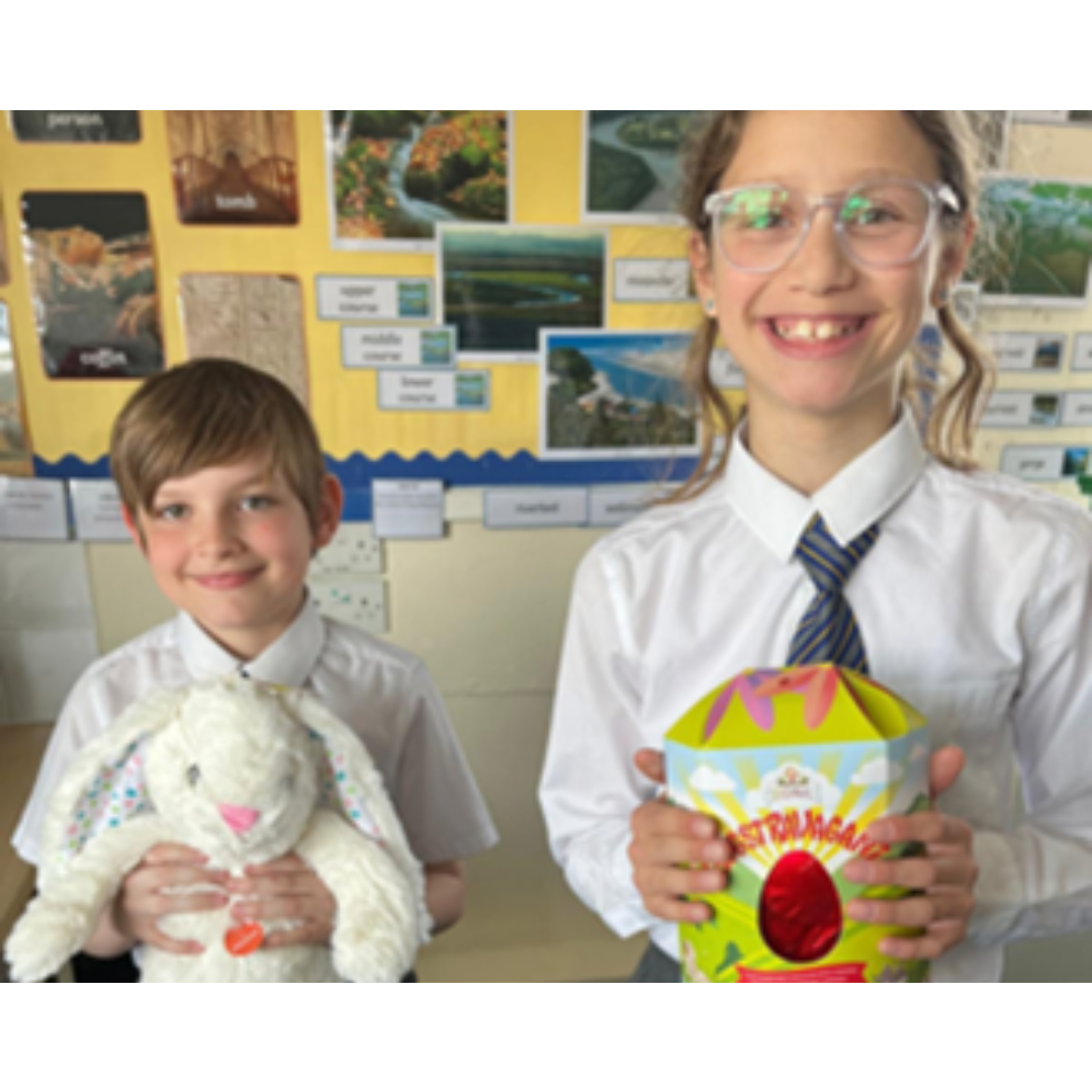 This is a picture of the Mini Vinnies with their raffle prizes