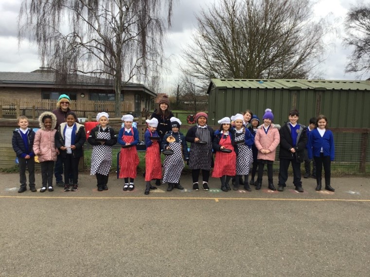 This is a photo of the children getting ready for a pancake day race