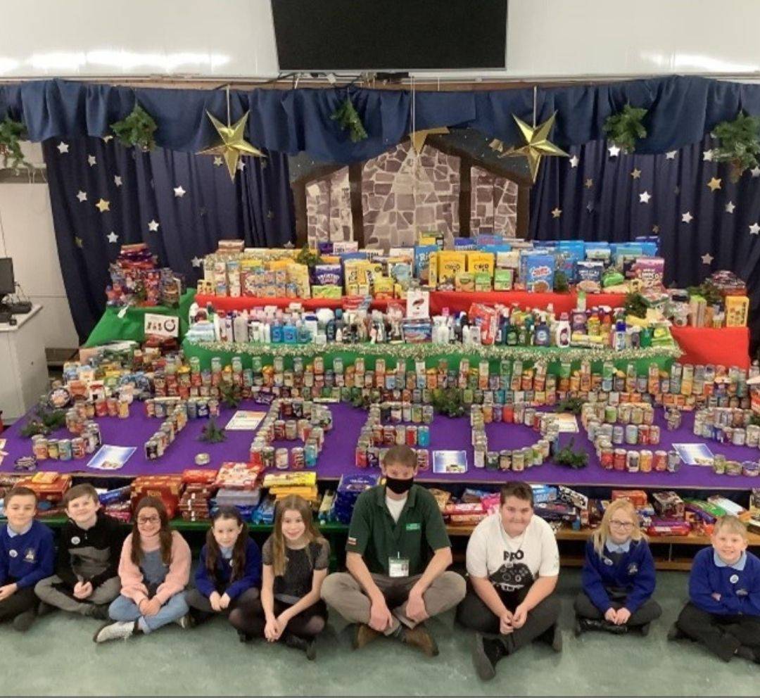 This is a photo of the Mini Vinnies at St Bede's, Washington with their huge collection of donated goods from their reverse Advent calendar. These went to Washington Community Food Project.