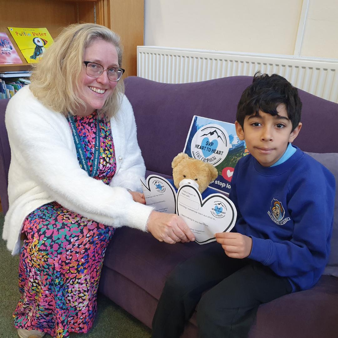 This is a picture of a teacher and pupil having a heart to heart.