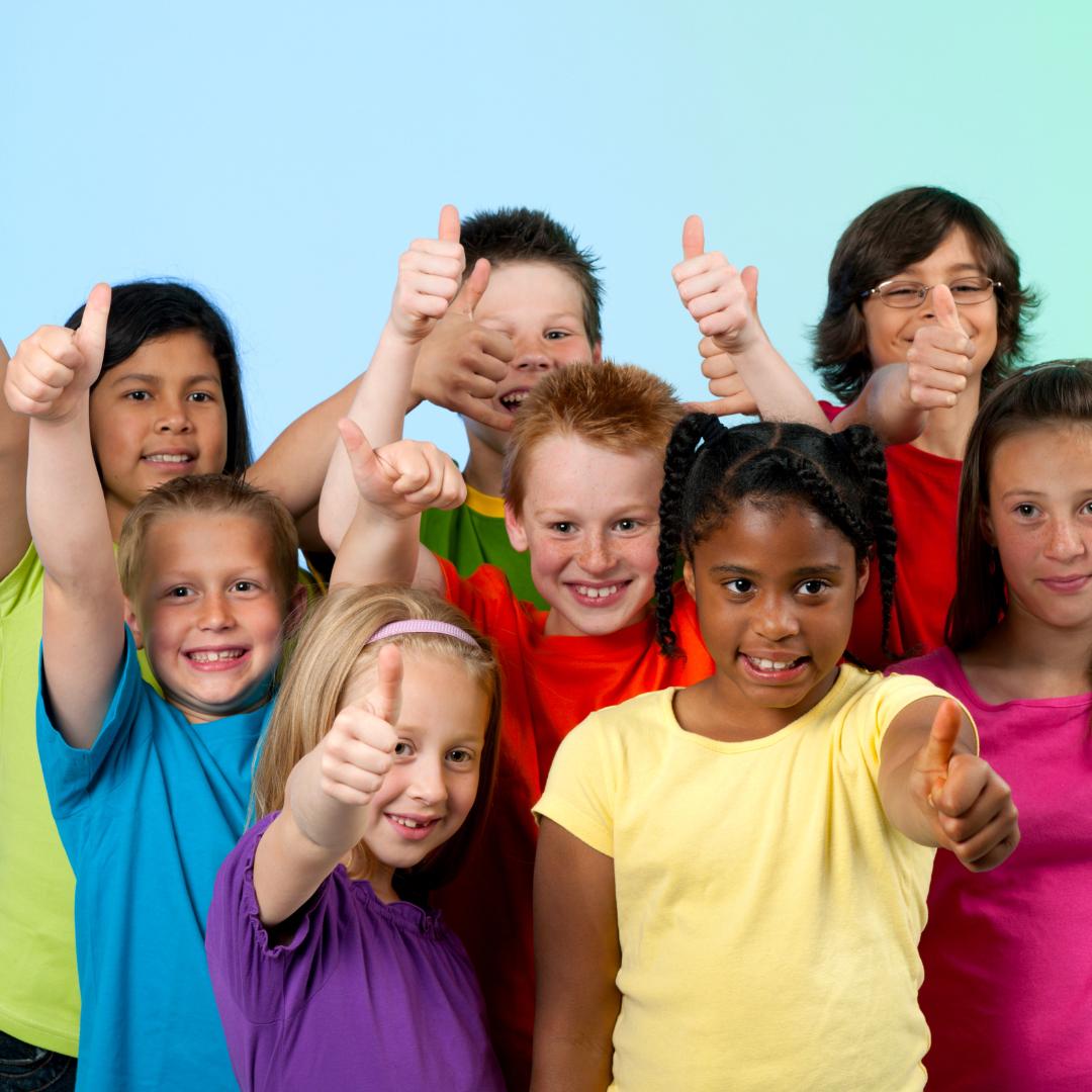 This is an image of a group of children with their thumbs up.