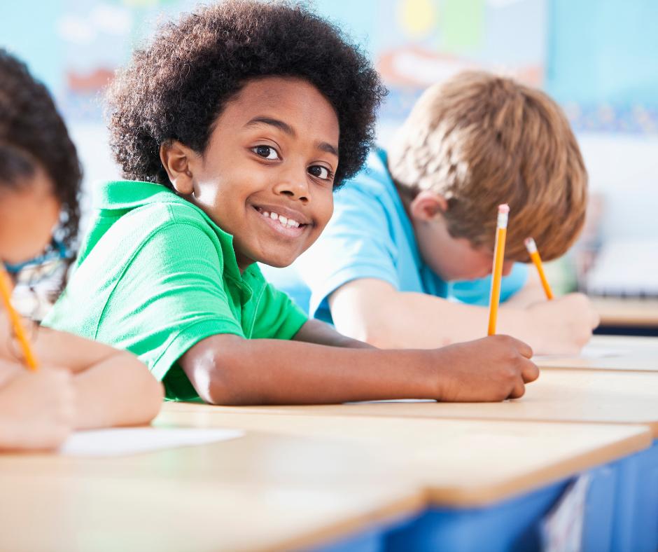 This is an image of children busy writing.