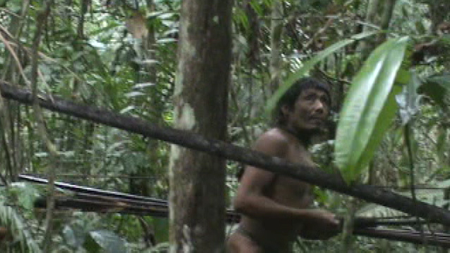 The last of the Kawahiva are forced to live on the run from armed loggers and powerful ranchers. Still from unique footage taken by government agents during a chance encounter.