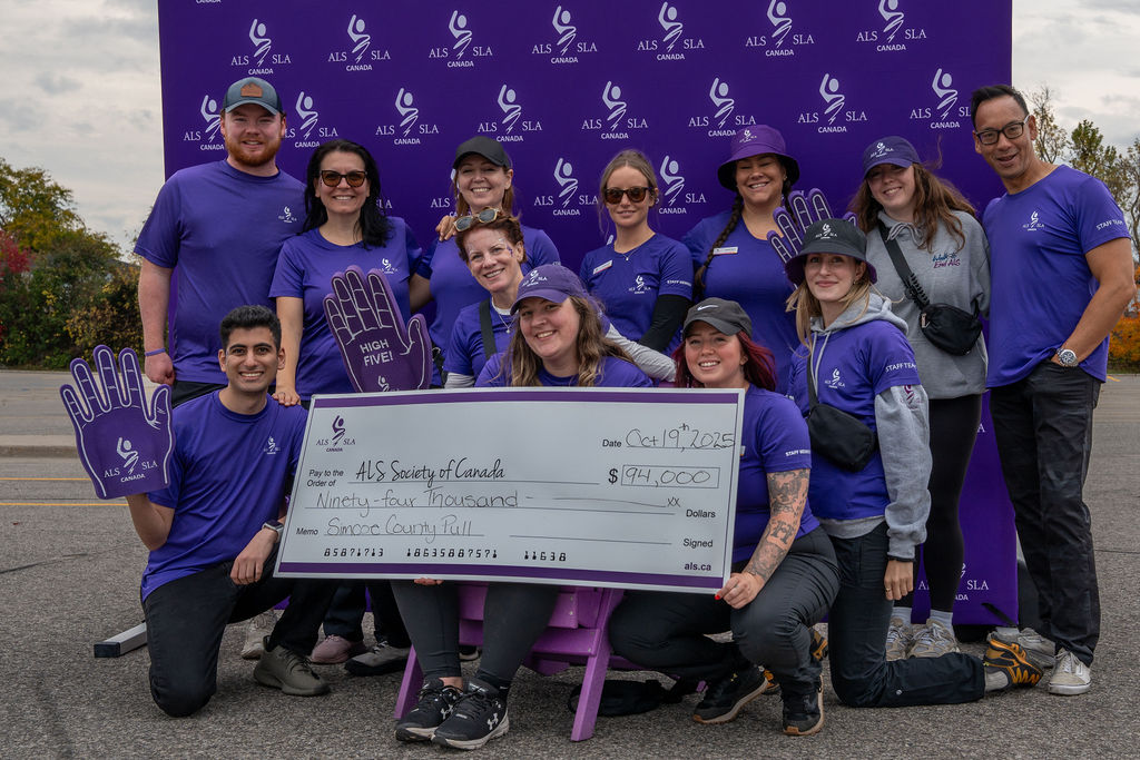 Participants pulling a truck at Pull to End ALS