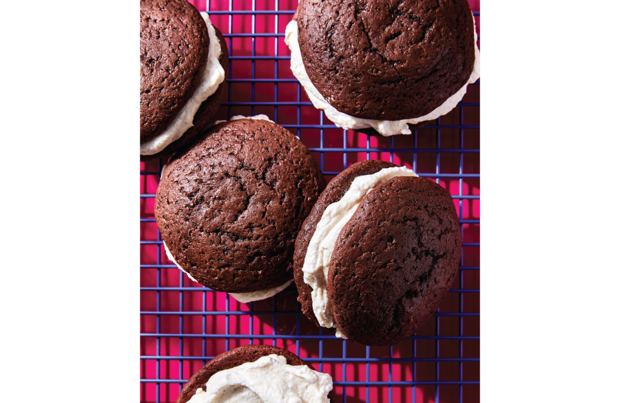 Chocolate whoopie pies on a dark pink and purple checked background