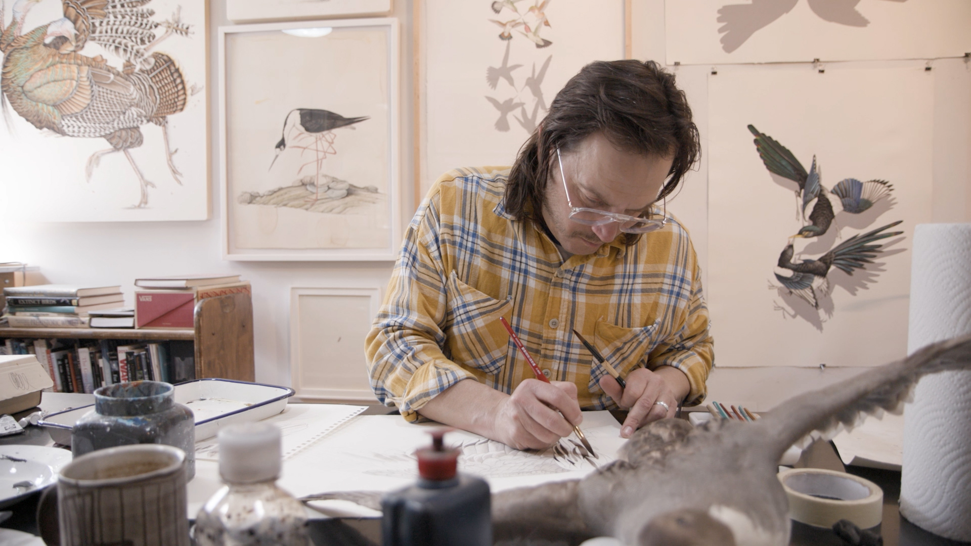 An artist works in their studio