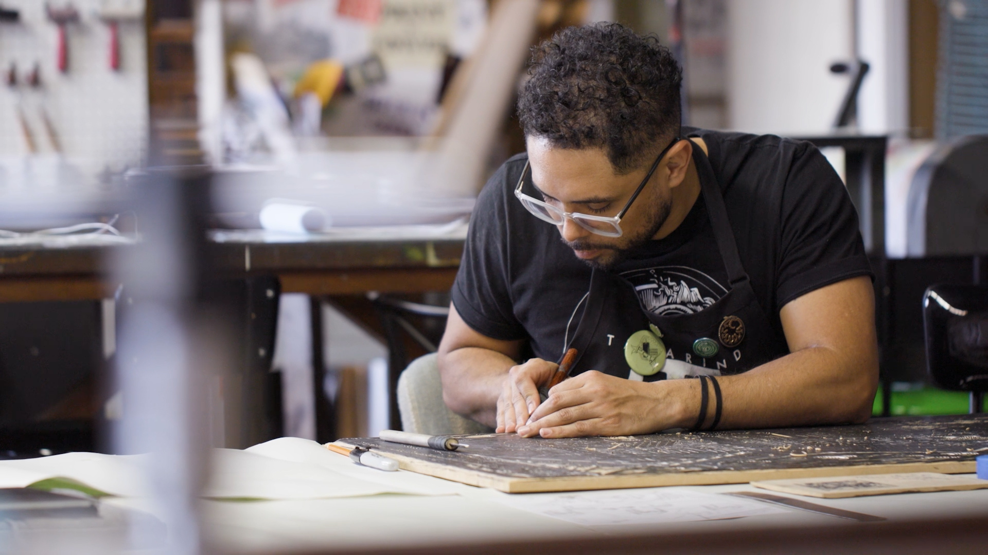 An artist works in their studio